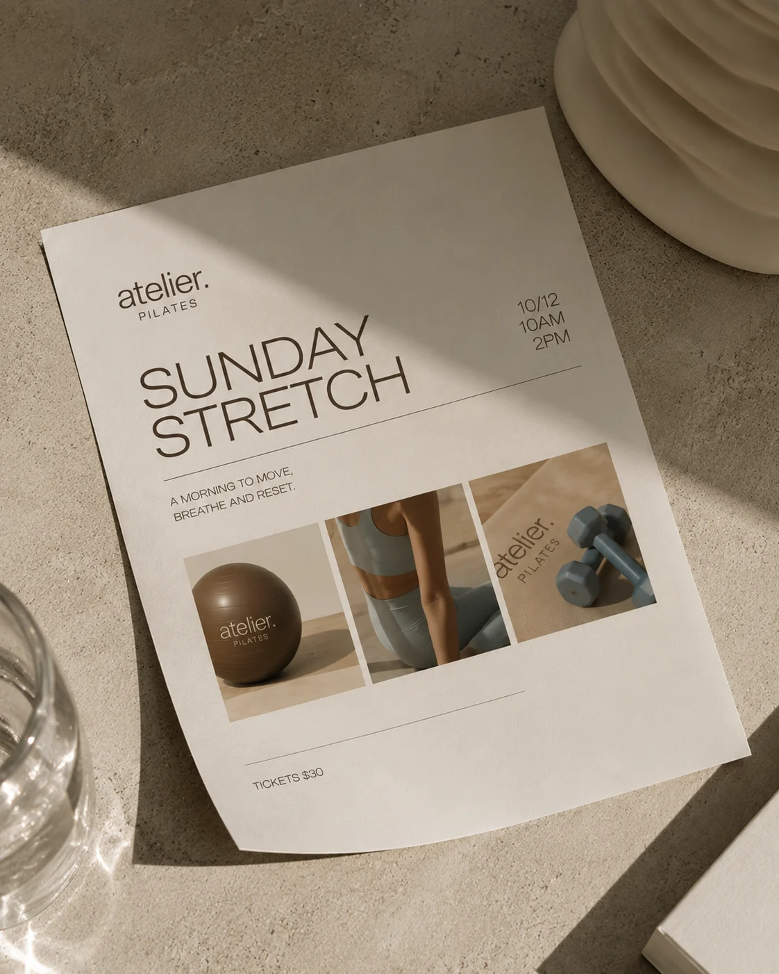 Sunday Stretch event poster on a stone counter — a morning to move, breathe and reset